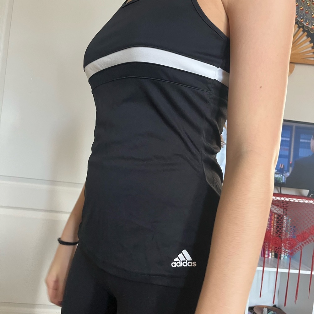 black addias athletic top with white line detail